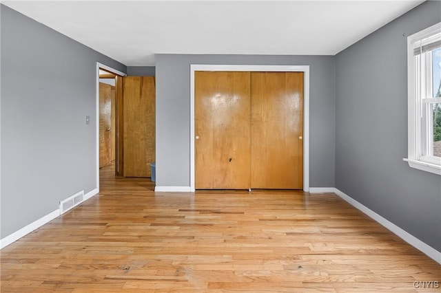 5647 Stevens Dr S, Cicero, NY 13039 - unfurnished bedroom featuring a closet and light wood-style flooring