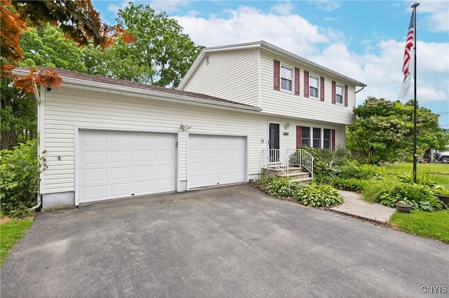 5647 Stevens Dr S, Cicero, NY 13039 - colonial inspired home featuring asphalt driveway and a garage