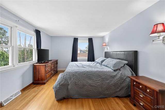 5647 Stevens Dr S, Cicero, NY 13039 - bedroom with multiple windows and light wood-style floors