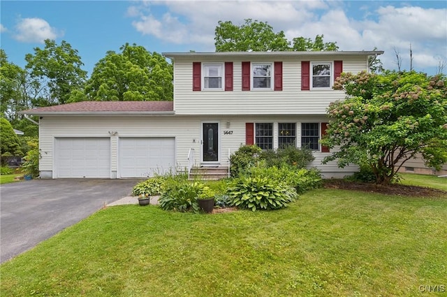 5647 Stevens Dr S, Cicero, NY 13039 - colonial house with driveway, a garage, and a front lawn