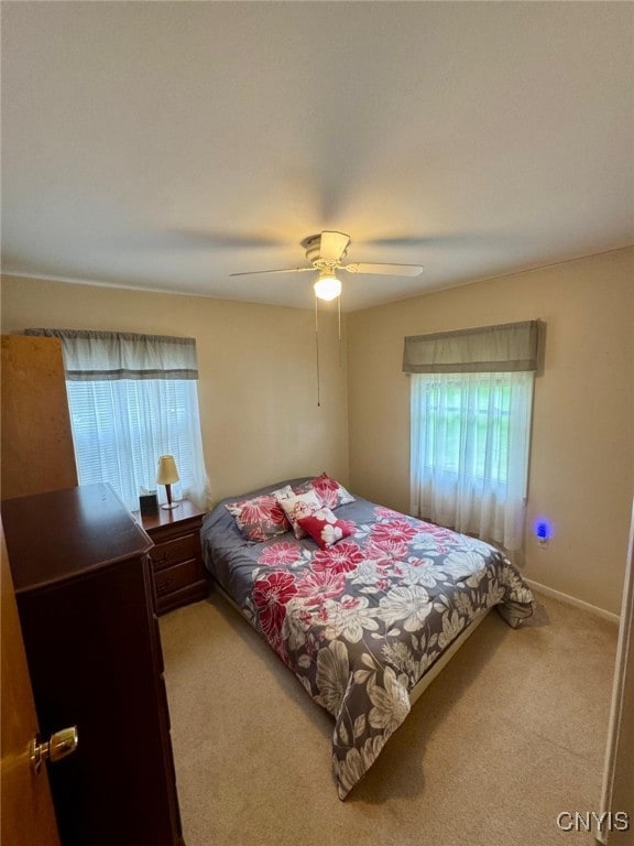 16 Locust Ave, Cortland, NY 13045 - carpeted bedroom with ceiling fan and baseboards