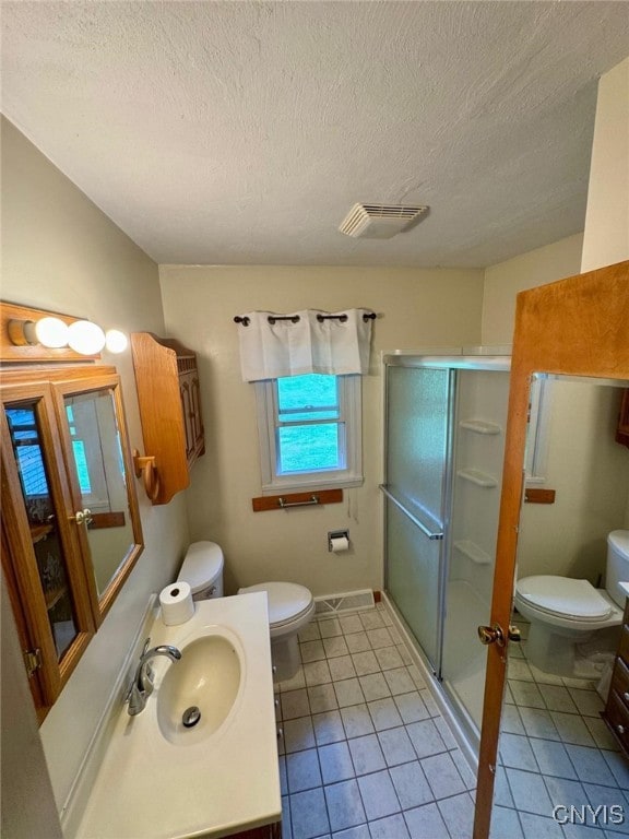 16 Locust Ave, Cortland, NY 13045 - full bathroom featuring a shower stall, vanity, tile patterned flooring, and a textured ceiling
