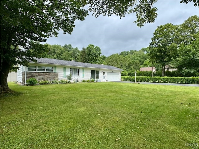 16 Locust Ave, Cortland, NY 13045 - ranch-style home featuring a garage, a front yard, asphalt driveway, and stone siding