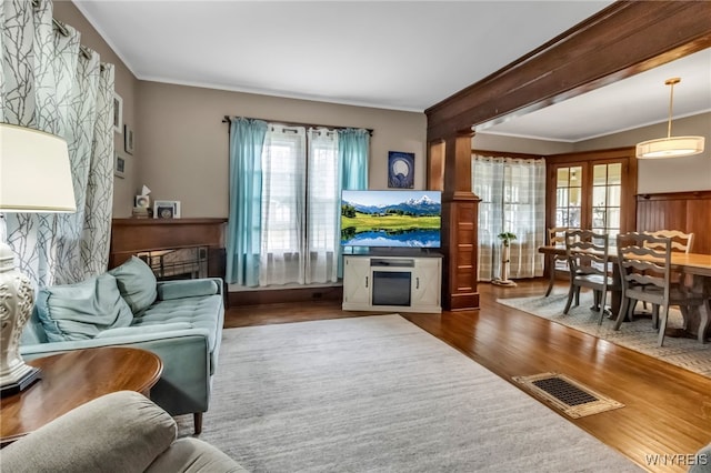 6467 Patchin Rd, Boston, NY 14025 - living room with a fireplace, wood finished floors, and ornamental molding