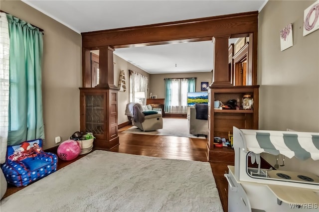 6467 Patchin Rd, Boston, NY 14025 - living room featuring wood finished floors and ornamental molding