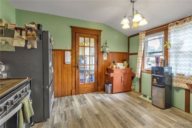 6467 Patchin Rd, Boston, NY 14025 - kitchen with a wainscoted wall, plenty of natural light, vaulted ceiling, light wood-type flooring, and a chandelier