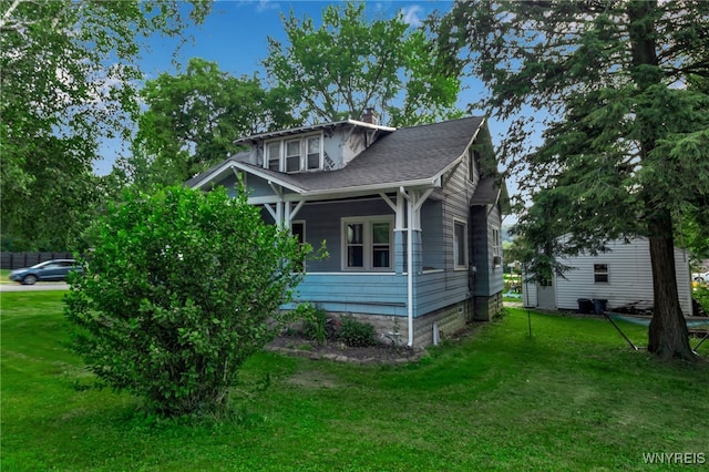 6467 Patchin Rd, Boston, NY 14025 - view of front facade with a front lawn, a chimney, and a shingled roof