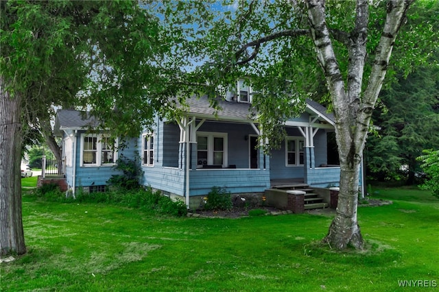 6467 Patchin Rd, Boston, NY 14025 - view of front facade with covered porch, a front yard, and roof with shingles