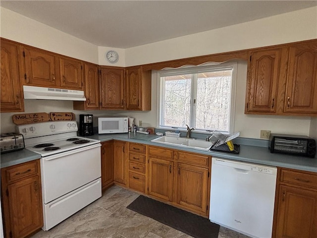 1237 County Highway 11, Davenport, NY 13860 - kitchen with white appliances, under cabinet range hood, and brown cabinets