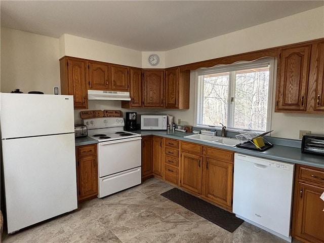 1237 County Highway 11, Davenport, NY 13860 - kitchen with white appliances, under cabinet range hood, and brown cabinets