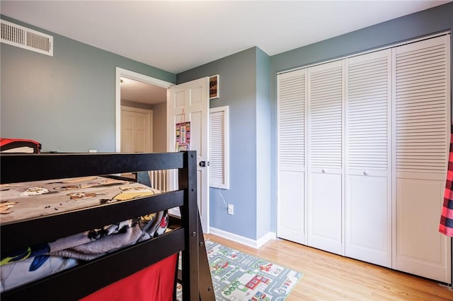 25 Killdeer Ln, Perinton, NY 14450 - bedroom featuring light wood-style flooring and a closet