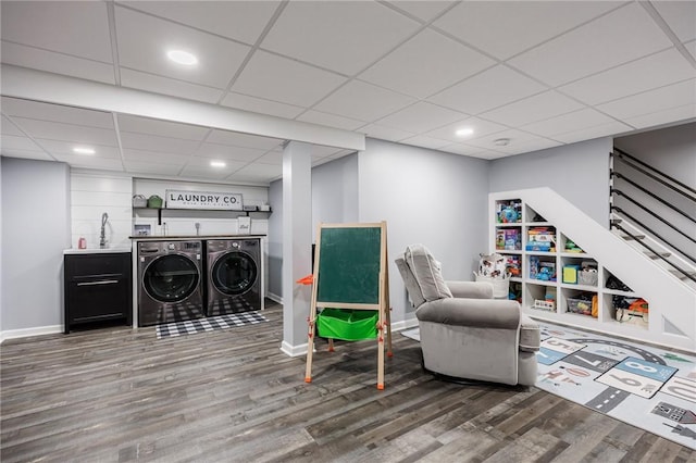 25 Killdeer Ln, Perinton, NY 14450 - sitting room with washer and clothes dryer, wood finished floors, stairs, a paneled ceiling, and recessed lighting
