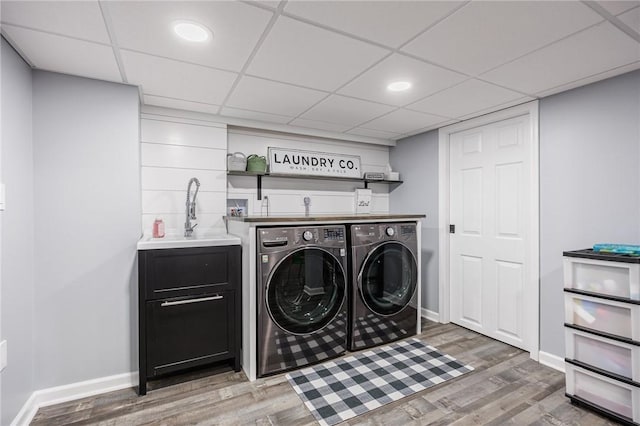 25 Killdeer Ln, Perinton, NY 14450 - washroom featuring independent washer and dryer, light wood-style flooring, and bar area