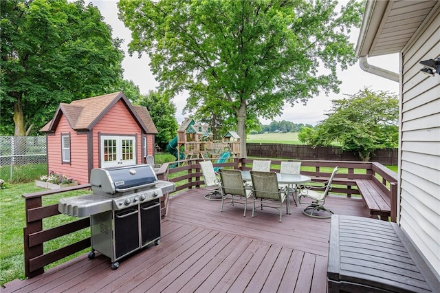 25 Killdeer Ln, Perinton, NY 14450 - deck featuring area for grilling, a fenced backyard, outdoor dining area, and a playground