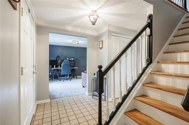 25 Killdeer Ln, Perinton, NY 14450 - foyer featuring light carpet, stairway, a textured ceiling, and light tile patterned flooring
