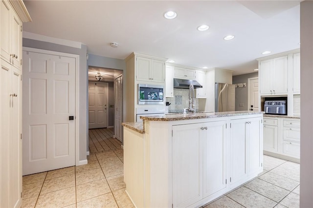 25 Killdeer Ln, Perinton, NY 14450 - kitchen featuring appliances with stainless steel finishes, under cabinet range hood, light tile patterned floors, decorative backsplash, and recessed lighting