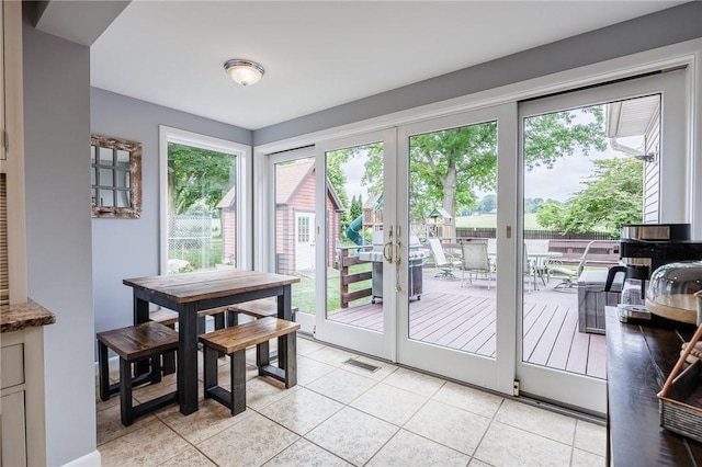 25 Killdeer Ln, Perinton, NY 14450 - entryway featuring healthy amount of natural light, french doors, and light tile patterned floors