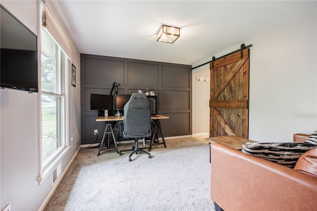 25 Killdeer Ln, Perinton, NY 14450 - home office featuring a decorative wall, light carpet, and a barn door