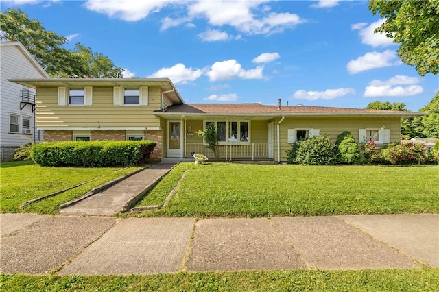 24 Gray St, Rochester, NY 14609 - split level home featuring a front lawn and brick siding