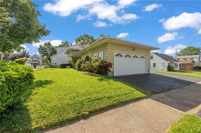 24 Gray St, Rochester, NY 14609 - view of side of property featuring a yard, driveway, and a garage