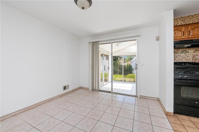 24 Gray St, Rochester, NY 14609 - unfurnished dining area featuring light tile patterned flooring and baseboards