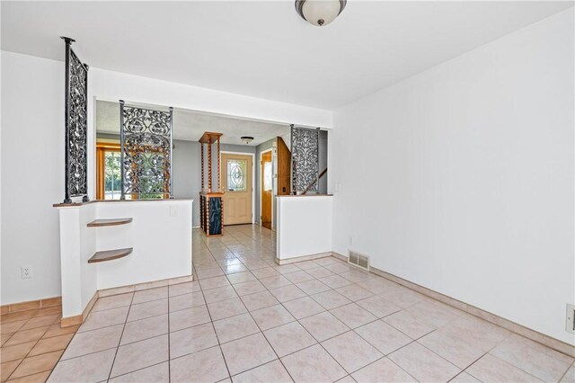 24 Gray St, Rochester, NY 14609 - unfurnished room with light tile patterned flooring and baseboards
