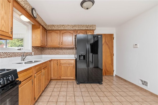 24 Gray St, Rochester, NY 14609 - kitchen featuring black appliances, light countertops, and decorative backsplash
