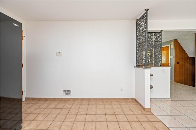 24 Gray St, Rochester, NY 14609 - spare room with light tile patterned flooring and baseboards