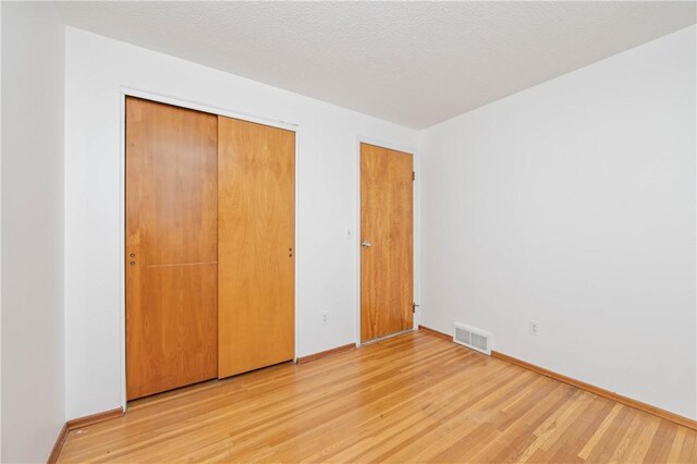 24 Gray St, Rochester, NY 14609 - unfurnished bedroom with light wood-style flooring