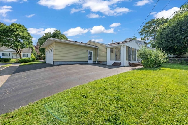 24 Gray St, Rochester, NY 14609 - view of front of house with entry steps, asphalt driveway, and a garage