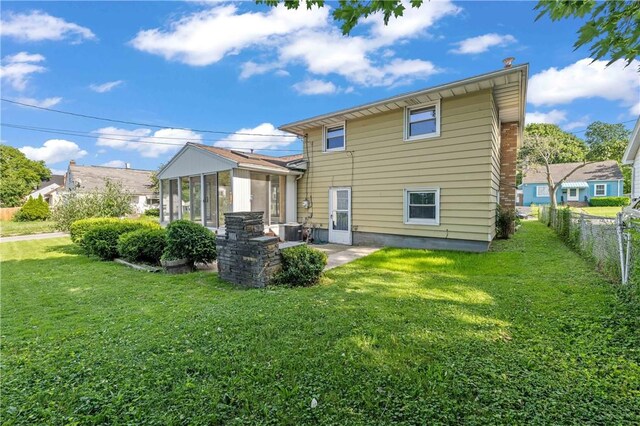 24 Gray St, Rochester, NY 14609 - back of house featuring a sunroom