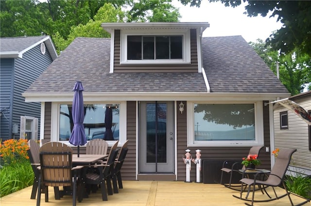 3904 Castle Point Rd, Starkey, NY 14842 - back of house with a wooden deck, roof with shingles, and outdoor dining space