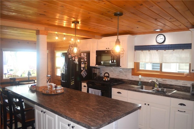 3904 Castle Point Rd, Starkey, NY 14842 - kitchen with black appliances, wood ceiling, a center island, and white cabinets