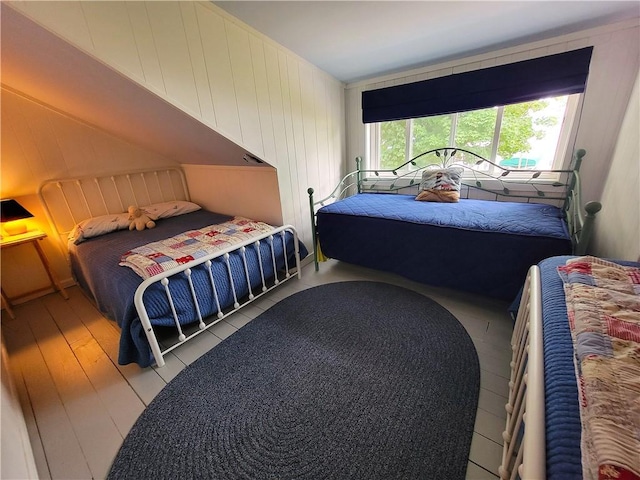 3904 Castle Point Rd, Starkey, NY 14842 - bedroom with wood-type flooring and wooden walls