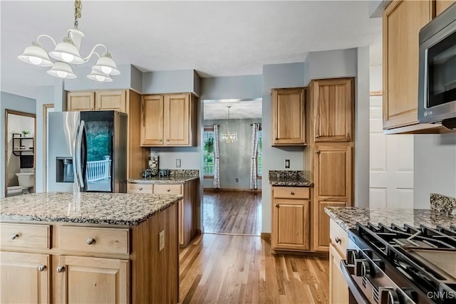 121 Ben Bar Cir, Whitestown, NY 13492 - kitchen with stainless steel appliances, a chandelier, light wood finished floors, light stone counters, and light brown cabinets