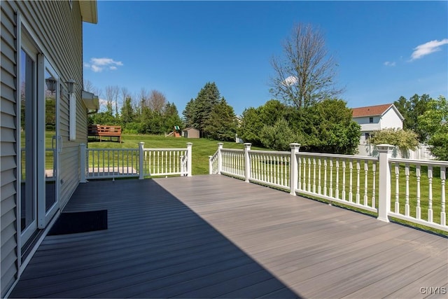 121 Ben Bar Cir, Whitestown, NY 13492 - wooden deck featuring a lawn and a storage unit