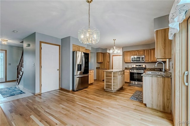 121 Ben Bar Cir, Whitestown, NY 13492 - kitchen with stainless steel appliances, a chandelier, light wood finished floors, and a kitchen island