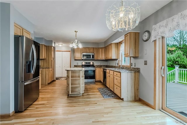 121 Ben Bar Cir, Whitestown, NY 13492 - kitchen featuring appliances with stainless steel finishes, a chandelier, light wood finished floors, decorative light fixtures, and dark stone countertops