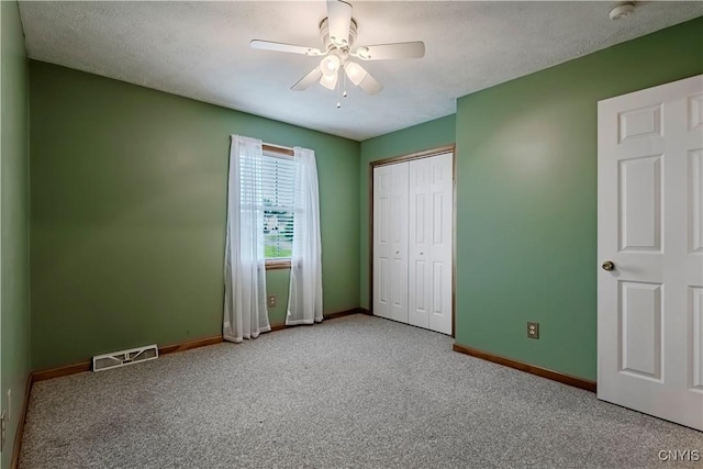 121 Ben Bar Cir, Whitestown, NY 13492 - unfurnished bedroom with carpet floors, a closet, and a ceiling fan