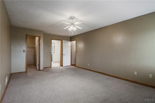 121 Ben Bar Cir, Whitestown, NY 13492 - unfurnished bedroom featuring a spacious closet, light colored carpet, a closet, and ceiling fan
