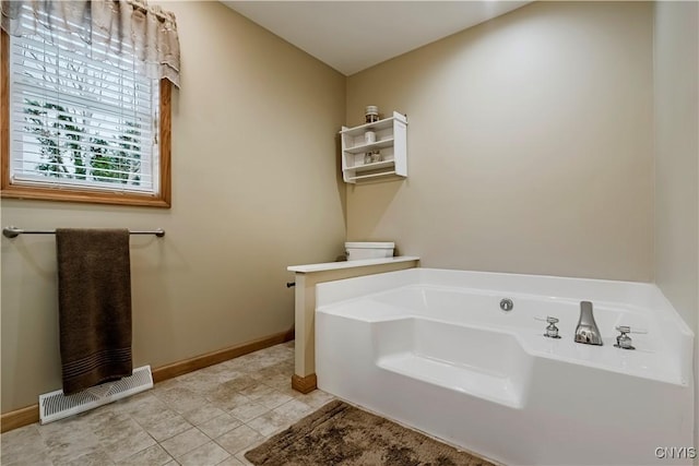 121 Ben Bar Cir, Whitestown, NY 13492 - bathroom featuring a garden tub and tile patterned flooring