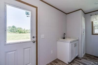 27634 County Route 342, Le Ray, NY 13612 - washroom with crown molding and wood finished floors