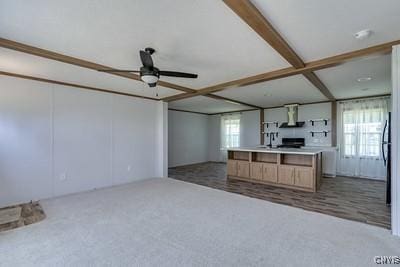 27634 County Route 342, Le Ray, NY 13612 - kitchen featuring range hood, carpet floors, ceiling fan, open floor plan, and beamed ceiling