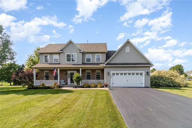 228 Southshore Pl, Webster, NY 14580 - colonial house featuring driveway, an attached garage, a porch, and a front lawn