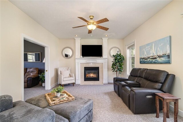 228 Southshore Pl, Webster, NY 14580 - living room with ceiling fan, a tiled fireplace, and carpet floors