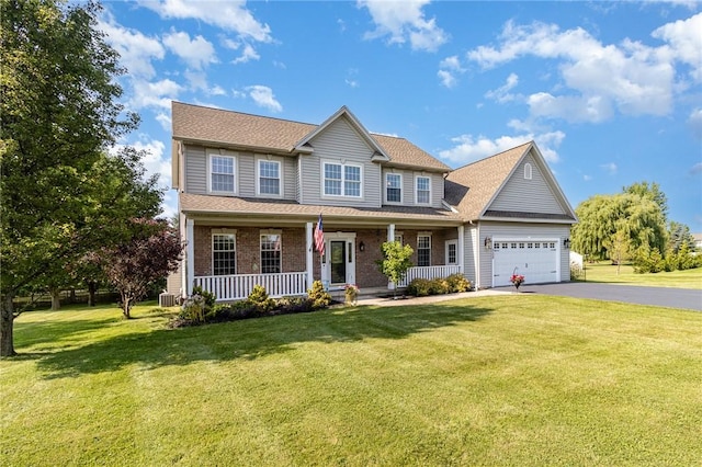 228 Southshore Pl, Webster, NY 14580 - colonial-style house featuring a porch, a garage, driveway, a front yard, and roof with shingles