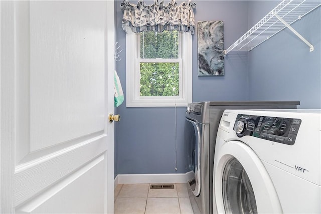 228 Southshore Pl, Webster, NY 14580 - laundry area featuring independent washer and dryer and light tile patterned floors