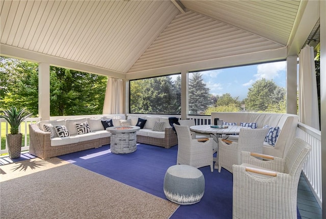 228 Southshore Pl, Webster, NY 14580 - sunroom / solarium with an outdoor living space with a fire pit, plenty of natural light, and outdoor dining area