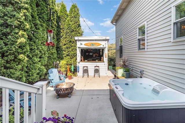 228 Southshore Pl, Webster, NY 14580 - view of patio / terrace featuring a hot tub and an outdoor fire pit