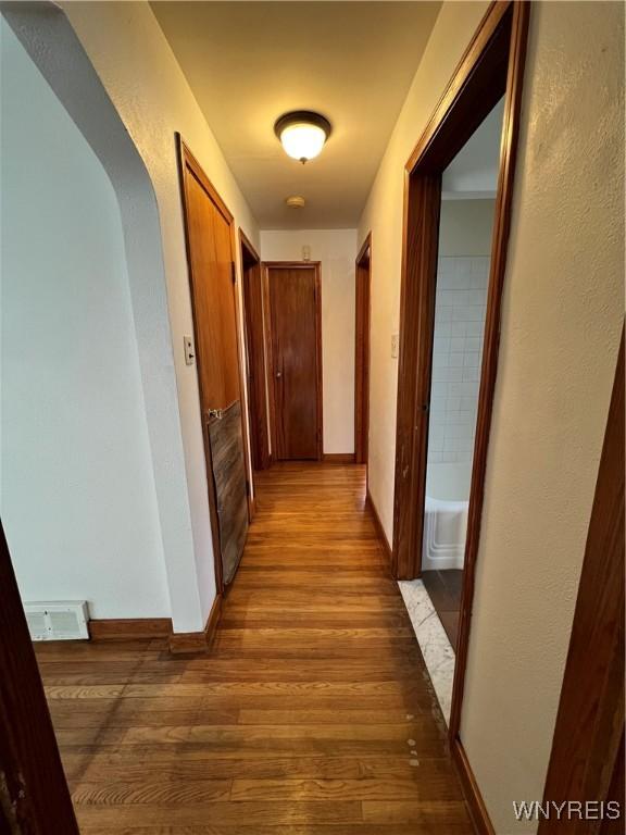 2479 Forest Ave, Niagara Falls, NY 14301 - hallway featuring wood finished floors and baseboards